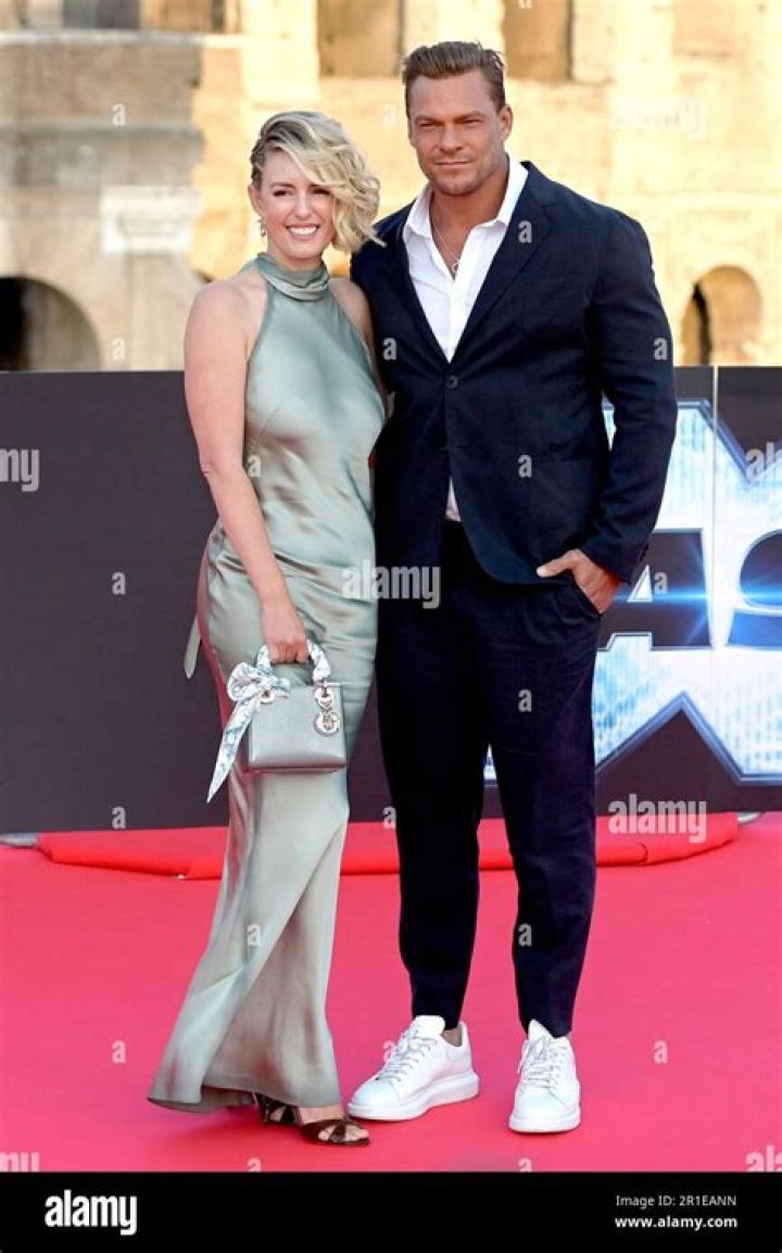 Catherine Ritchson and Alan Ritchson attend the red-carpet.