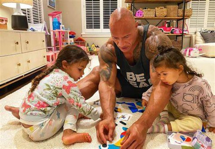 Dwayne playing with his daughters