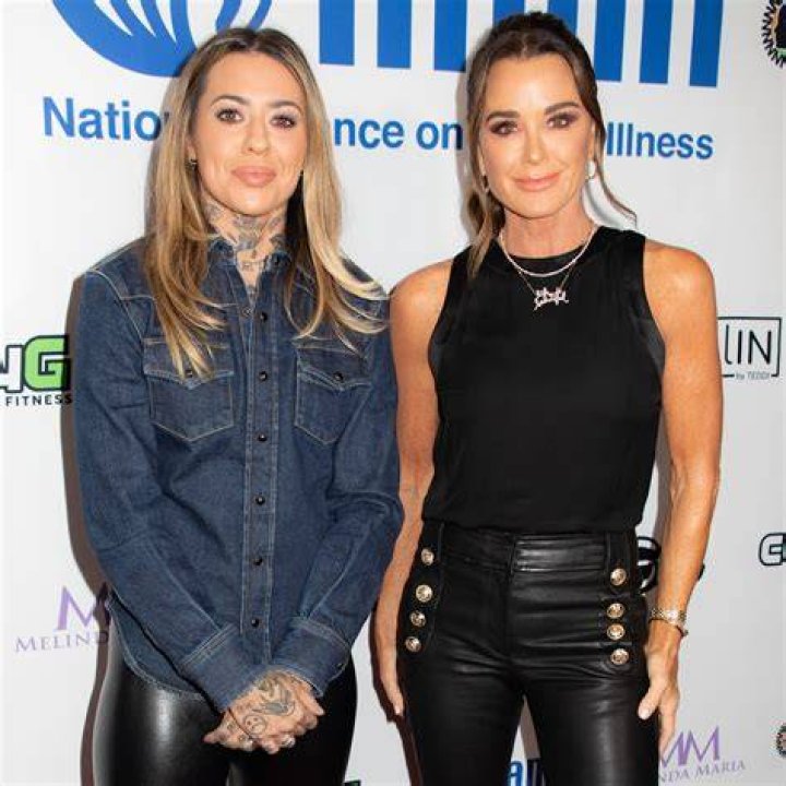 Morgan and her partner both in black