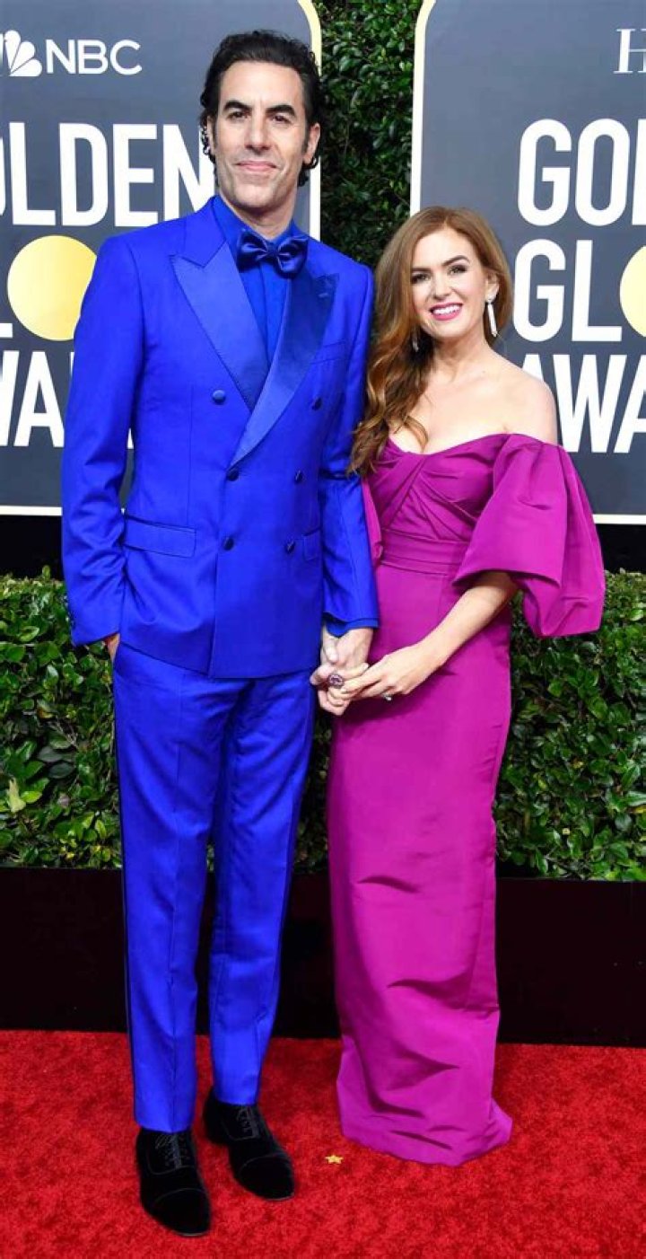 Sacha Baron Cohen and Isla Fisher chatting and sharing snacks together